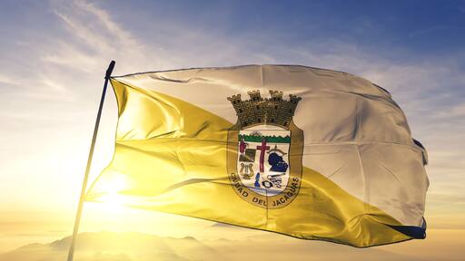 Juana Diaz municipality of Puerto Rico flag waving on the top sunrise mist fog