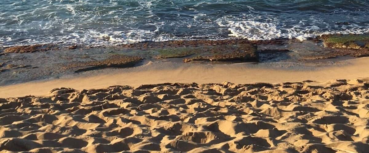 Beautiful beach located at the north coast of my hometown; Manatí, Puerto Rico. Light sand, dark rocks, mirrored sky-waters, soothing waves sounds. 
Perfect spot to see the sunrise or as I did, the sunset. Photo was taken during my vacations there on Jan 20th, 2017. 
#beachbound #MarChiquitaBeach
#Manati,PR
