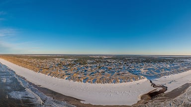 Drone panorama over Vejers beach in Denmark with sunshine and snow