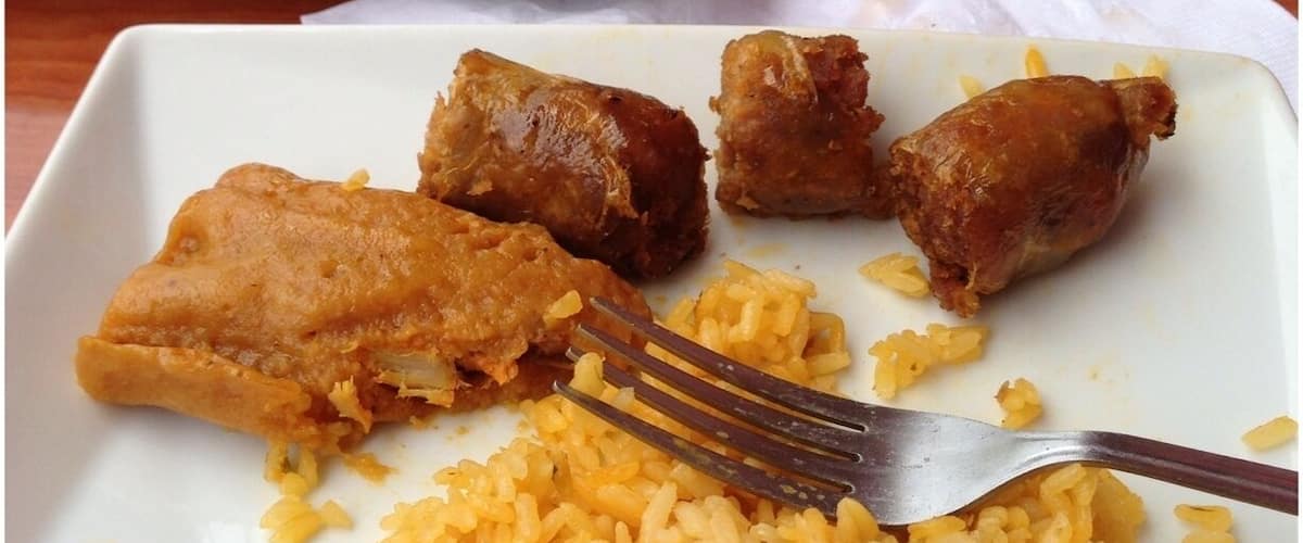 A plate of fried chicken and rice.