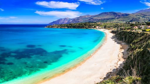 Empty tropical-like beach in Scopello, Sicily. Crystal clear turquoise water and white sand at Zingaro Nature Reserve, Italy. No people
