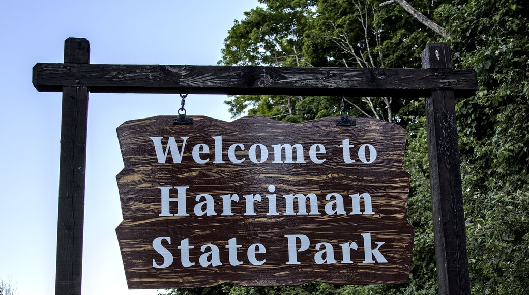 Welcome to Harriman State Park sign on Seven Lakes Drive at entrance to famous hiking destination.