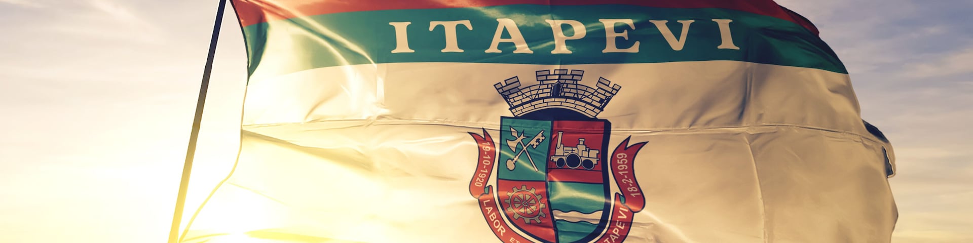 Itapevi of Brazil flag waving on the top sunrise mist fog