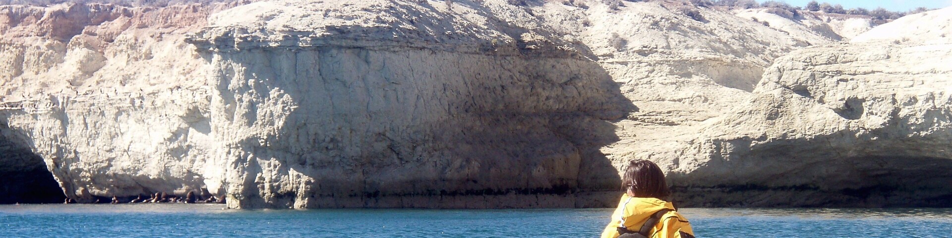 Chubut featuring kayaking or canoeing and rocky coastline