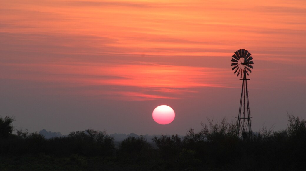Santa Fe Province showing a sunset, landscape views and farmland
