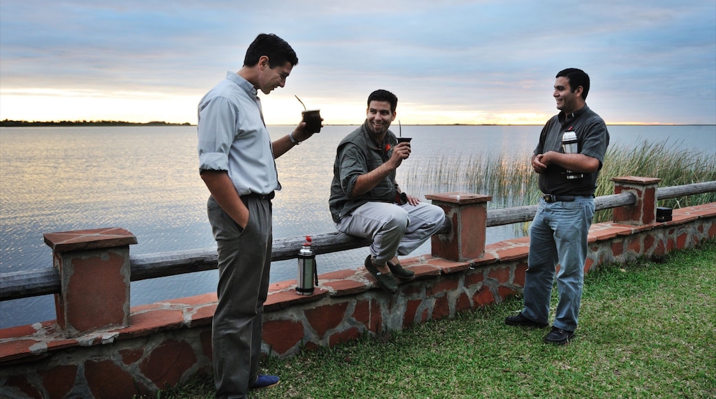 Corrientes showing a river or creek as well as a small group of people