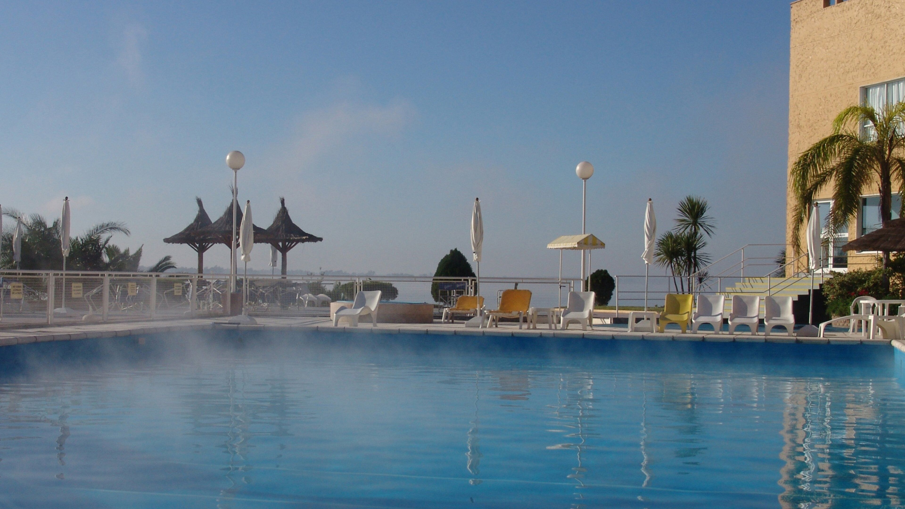 Santiago del Estero which includes a pool, mist or fog and a luxury hotel or resort
