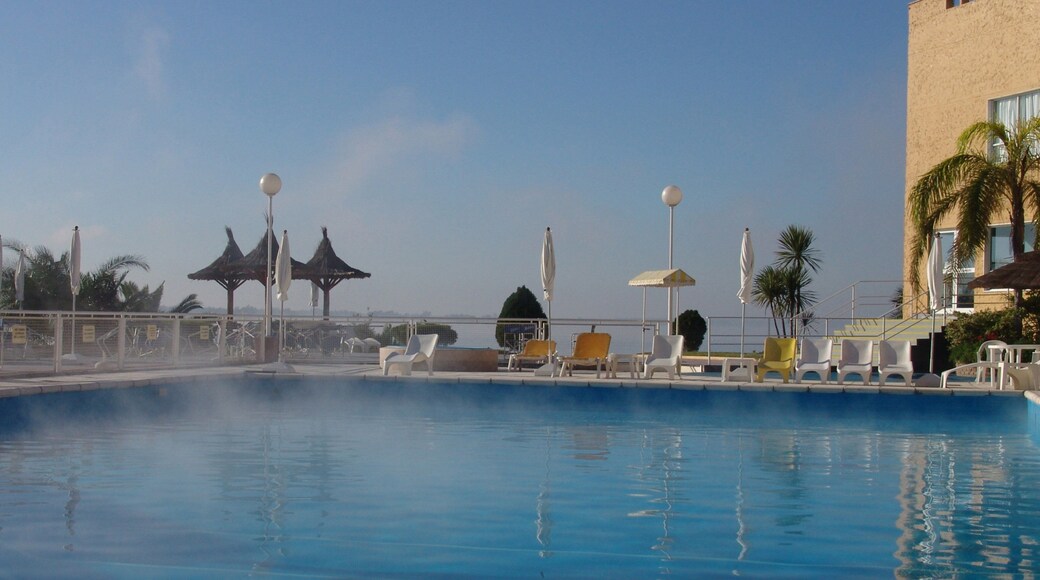 Santiago del Estero which includes a pool, mist or fog and a luxury hotel or resort