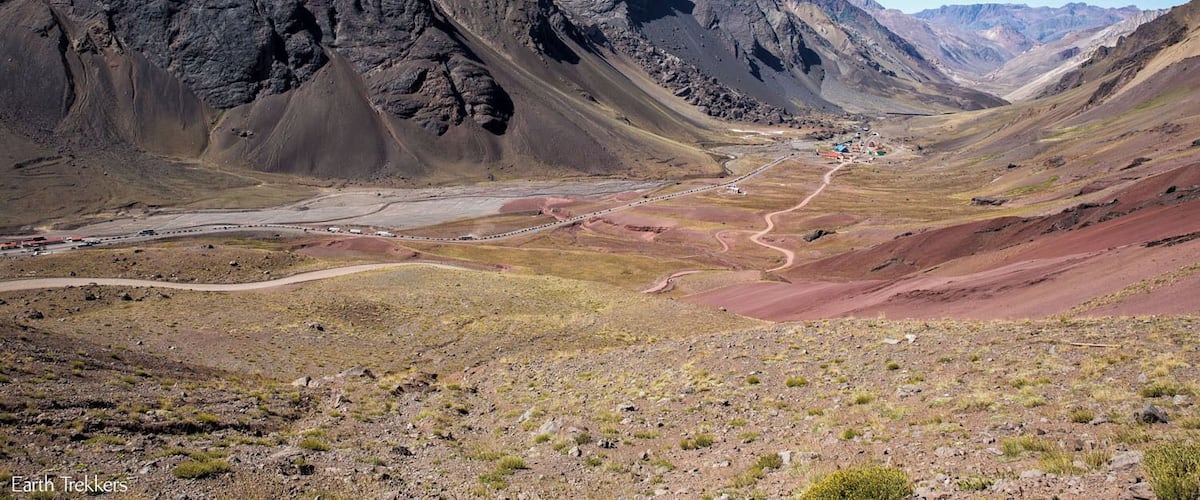 Driving the dirt road over the Andes Mountains between Chile and Argentina. It is possible to take a winding, dirt road up to Christ the Redeemer of the Andes...a white-knuckle journey but with the reward of amazing views of these mountains. To read about what it was really like, read our post: http://www.earthtrekkers.com/driving-cristo-redentor-de-los-andes/ #adventure #roadtrip #mountains #dangerousroad