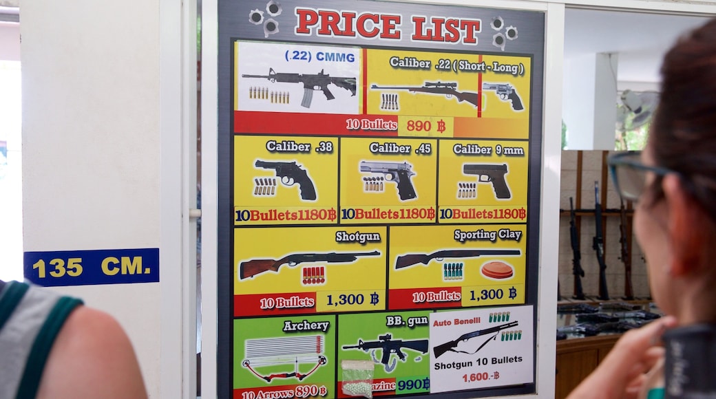 Phuket Shooting Range which includes signage and interior views