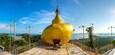 Replica of Phra That in Kwaen (Golden Rock) in Wat Koh Sirey temple in Phuket in Thailand in a summer day