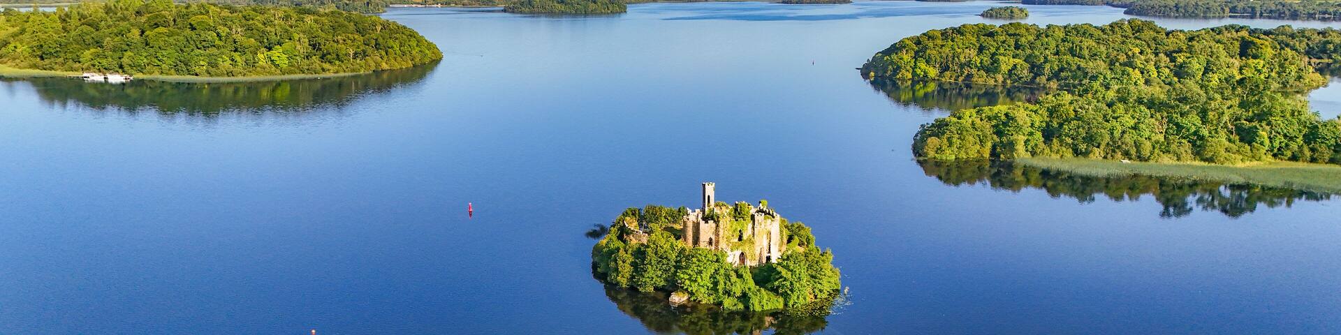 Aerial drone view of McDermotts Castle on small island in Lough Key lake, county Leitrim, Ireland
