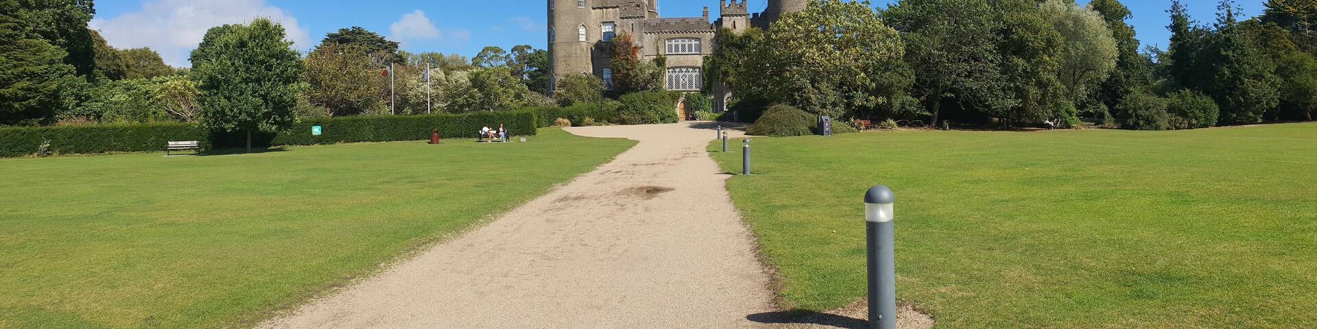 Panoramic shot of a road leading to the Malahide Castle in Malahide, Ireland