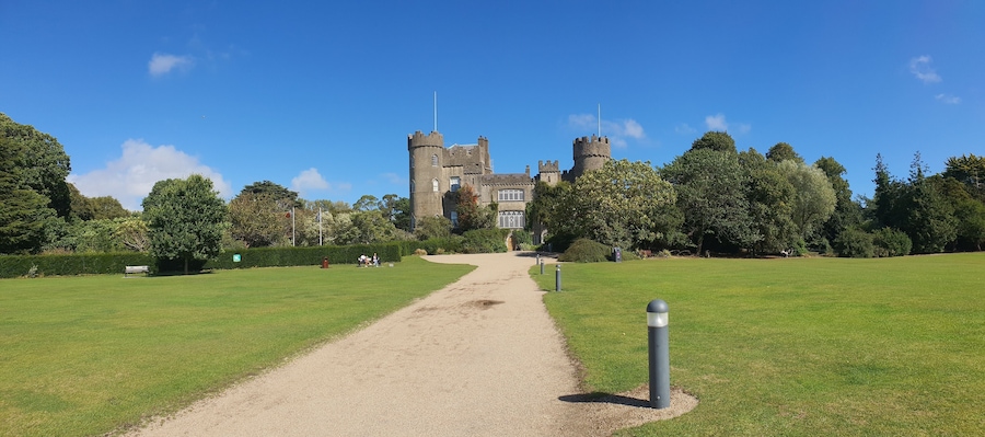 Panoramic shot of a road leading to the Malahide Castle in Malahide, Ireland