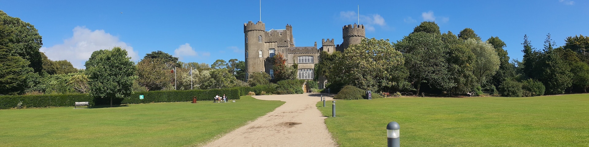 Panoramic shot of a road leading to the Malahide Castle in Malahide, Ireland