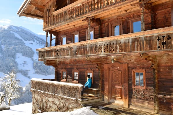 Alpbach which includes a small town or village and snow