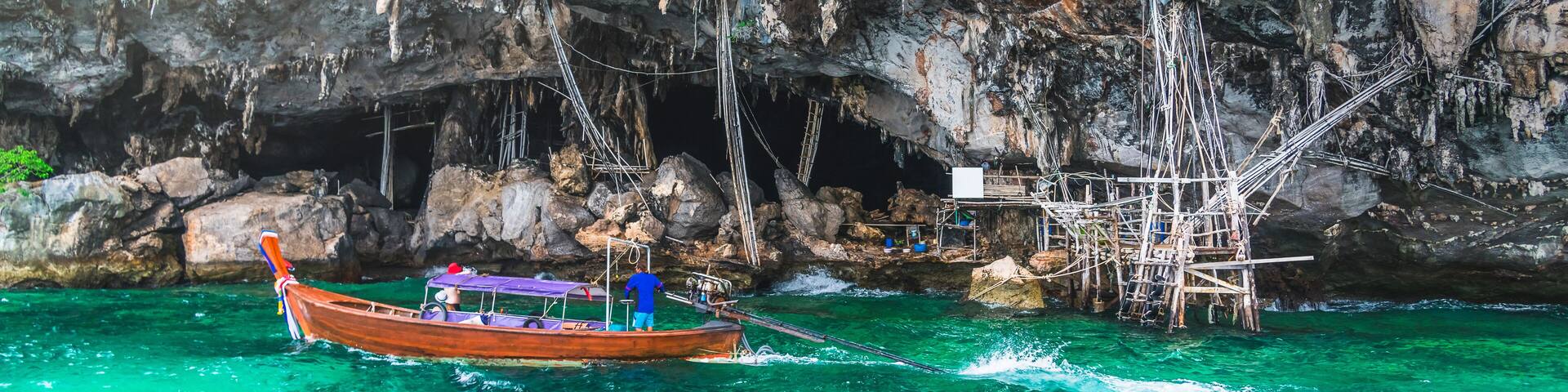 Landscape of Viking cave with longtail boat for traveler Phi Phi island Krabi, Famous landmark tourist travel Phuket Thailand summer holiday vacation trips, Tourism beautiful destinations place Asia
