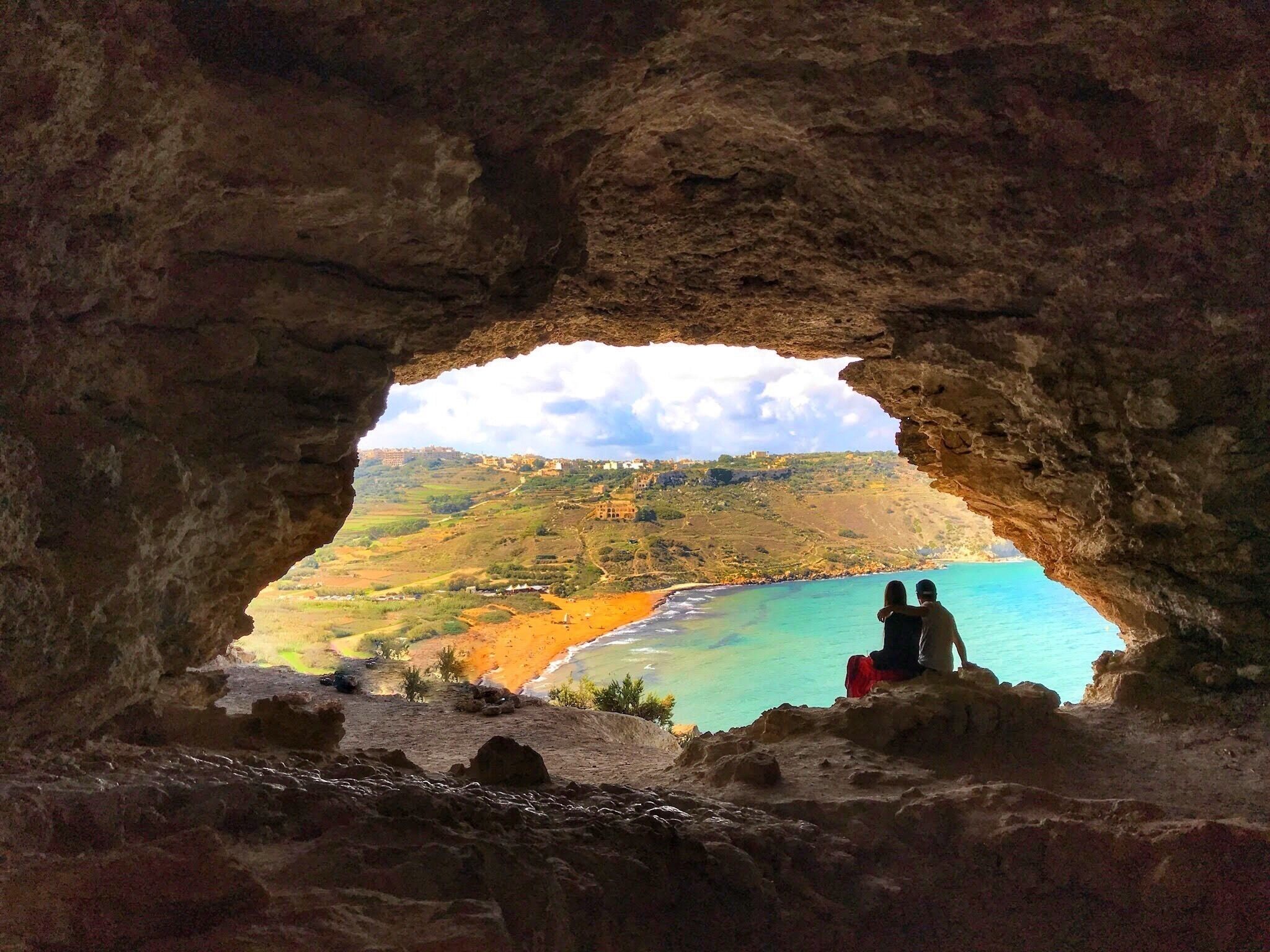 Malta is full of beautiful stops! This cave overlooks Ramla Bay. The view is out of this world! Perfect to enjoy with a loved one. There are signs of people camping inside of the cave which could make for a fun #Adventure with your group while in Malta! There are two access points: 1. from the street and 2. walking up from Ramla Bay beach! Get yourself here and admire the view!