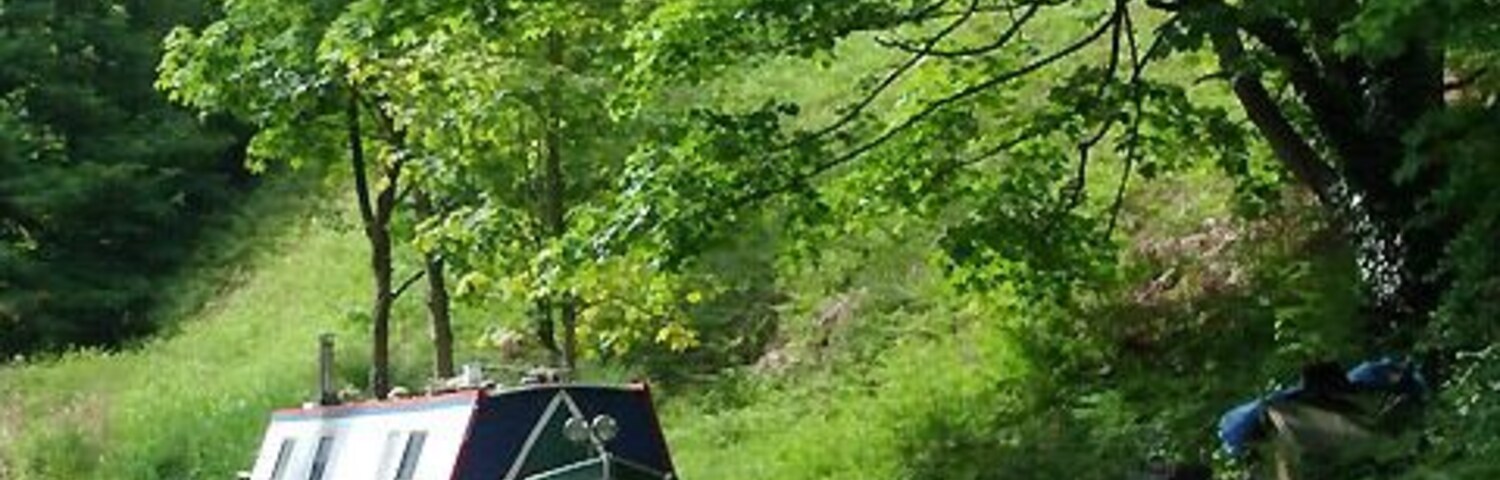 Private moorings at Brewood, Staffordshire On the Shropshire Union Canal at Brewood there are many narrowboats legally moored to land opposite the towpath. The British Waterways Board are actively reducing this facility. The canal was built by Thomas Telford and opened in 1835. He attempted to minimise the distance by adopting straight lines wherever possible, so his canal includes many long embankments, and cuttings (as here at Brewood).