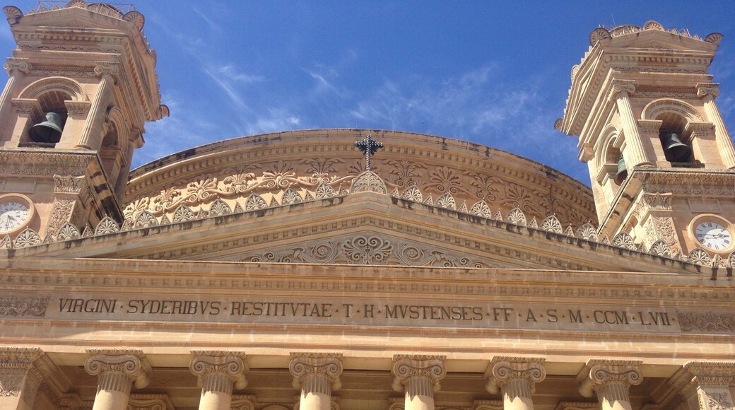During WWII a bomb fell through the center skylight during a service and no one was injured. The Mosta Miracle