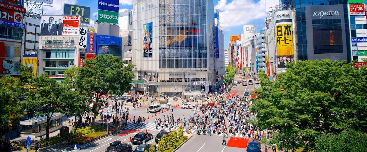 Shibuya Crossing featuring a city, a square or plaza and modern architecture