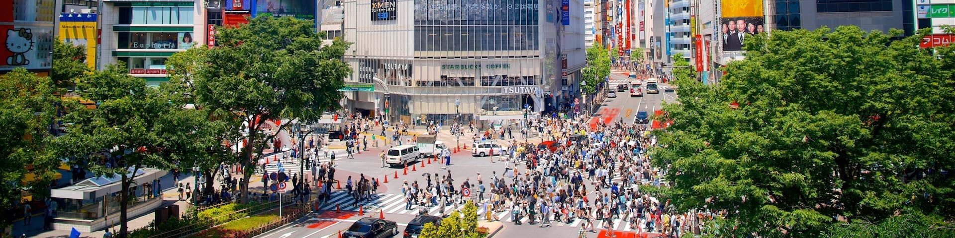 Shibuya Crossing featuring a city, a square or plaza and modern architecture
