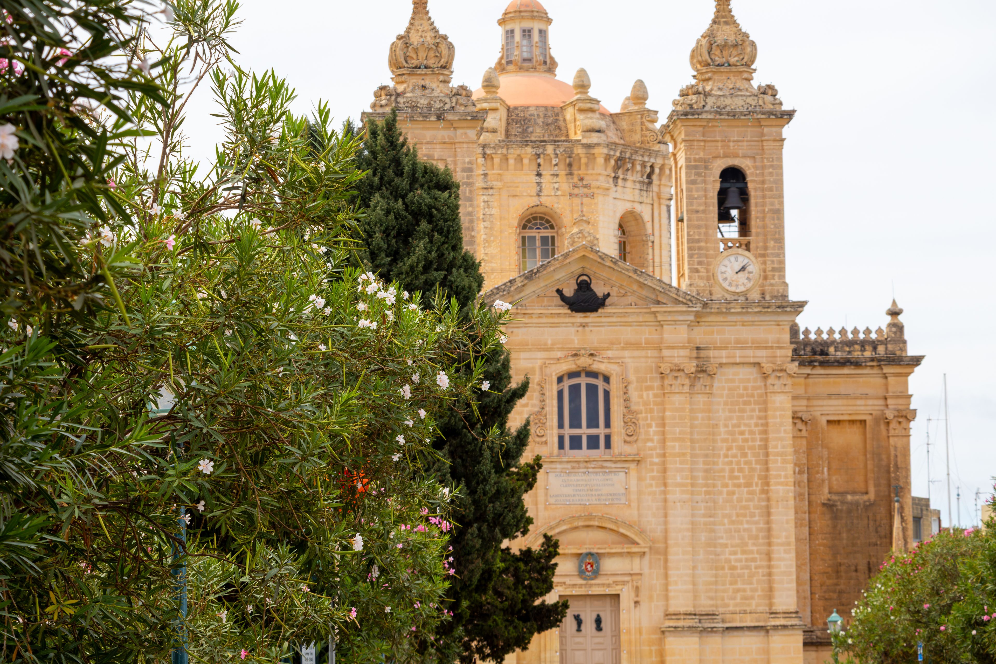 A historic building with a clock tower and ornate architecture.