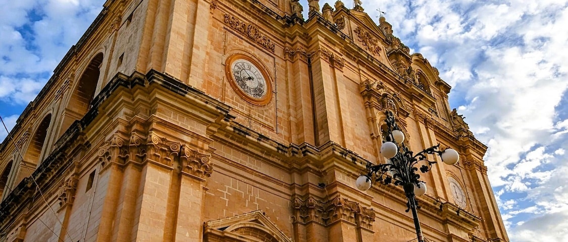 Imposing Facade of St. Helen's Basilica Under a Blue Sky, Malta