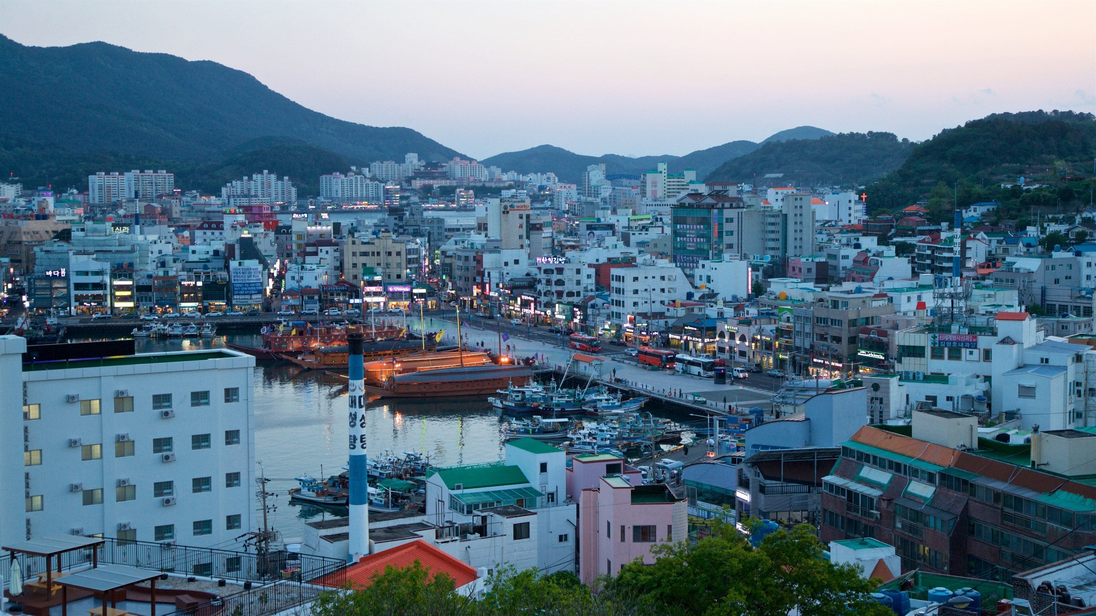 Tongyeong which includes a sunset, landscape views and a city