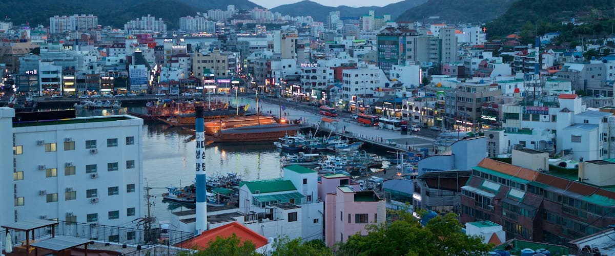 Tongyeong which includes a sunset, landscape views and a city