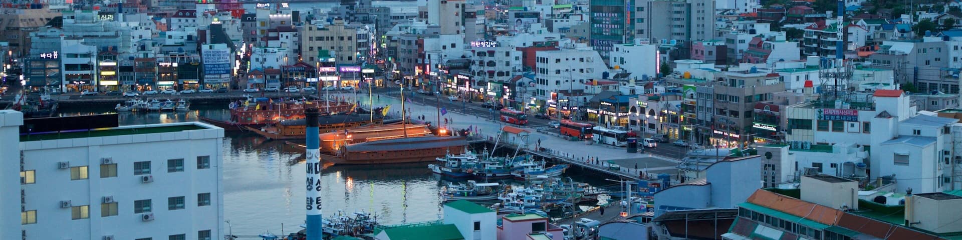 Tongyeong which includes a sunset, landscape views and a city