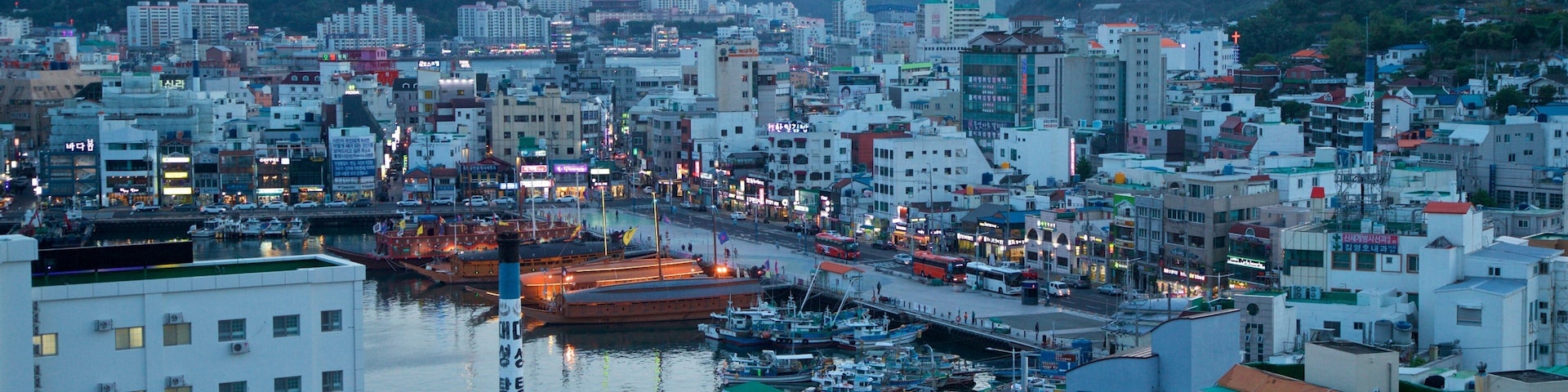 Tongyeong which includes a sunset, landscape views and a city