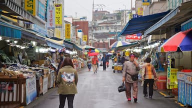 Tongyeong which includes markets and street scenes as well as a small group of people
