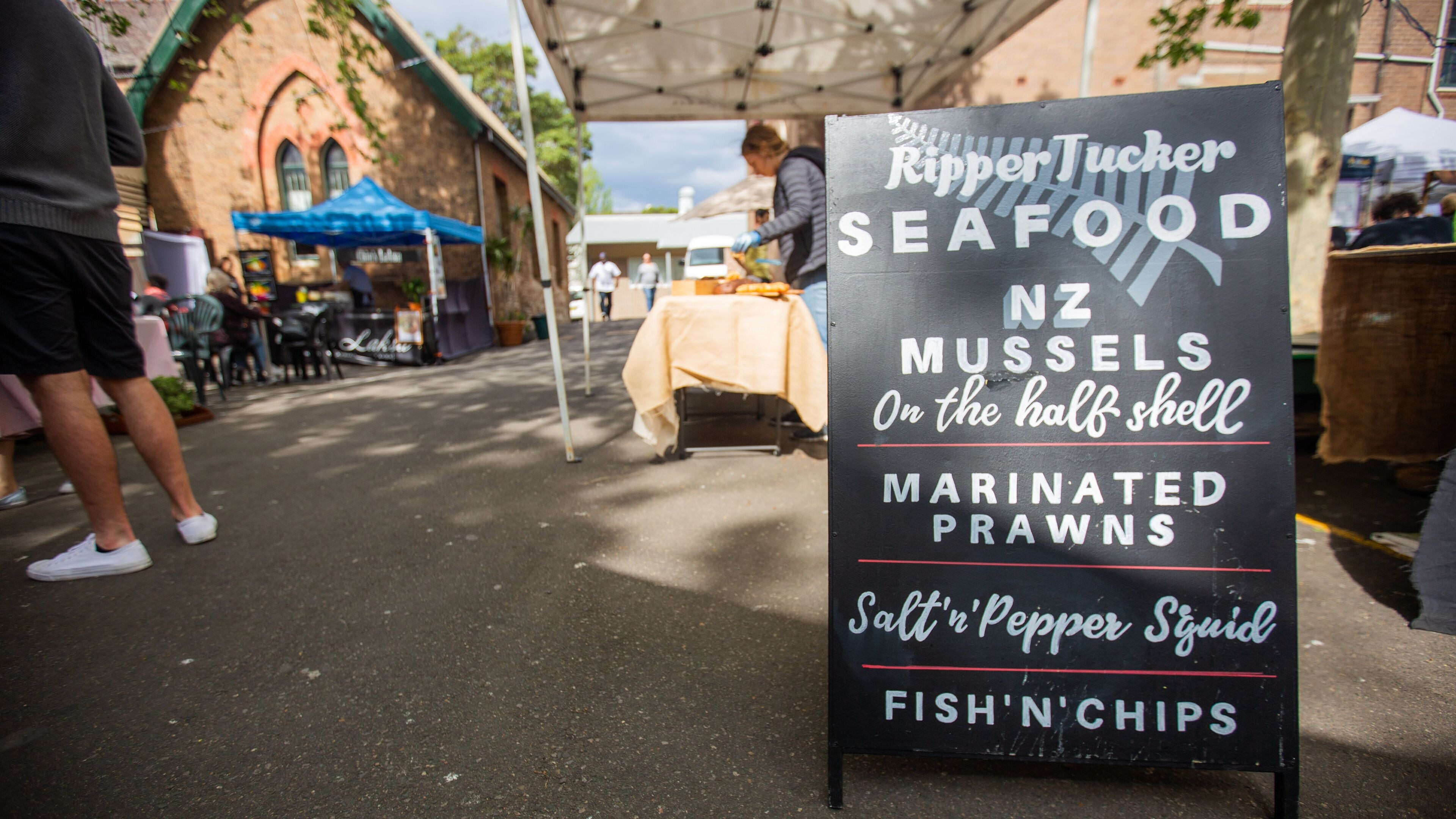 Paddington Markets featuring signage and markets