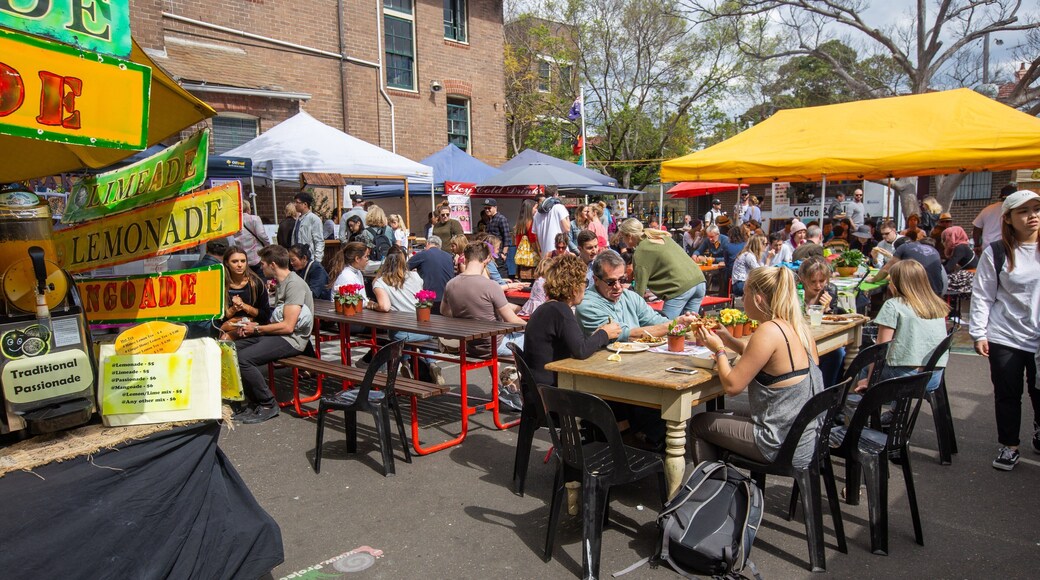 Paddington Markets featuring markets and street scenes as well as a large group of people