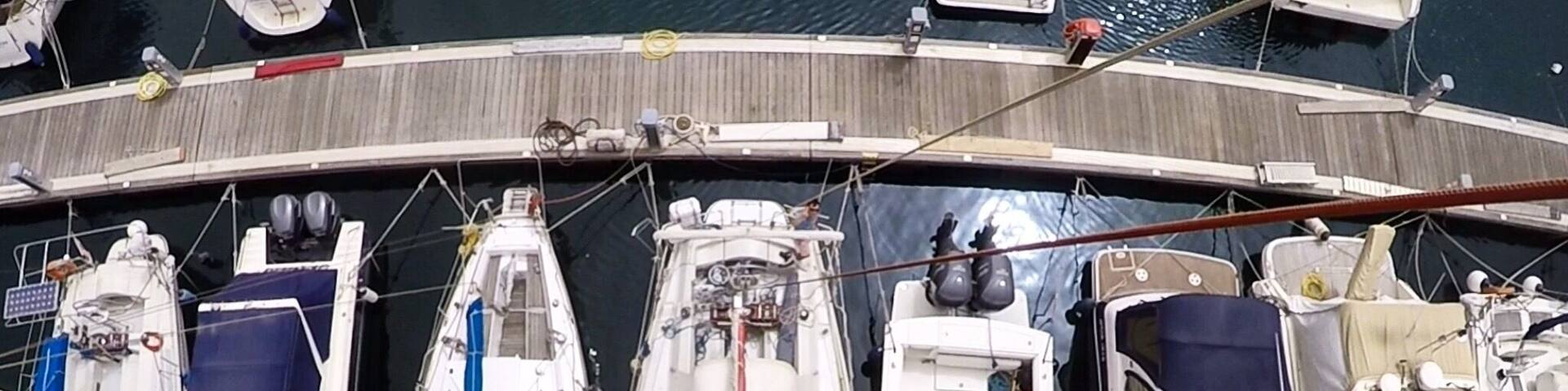 View to the boats in marina from top of the mast