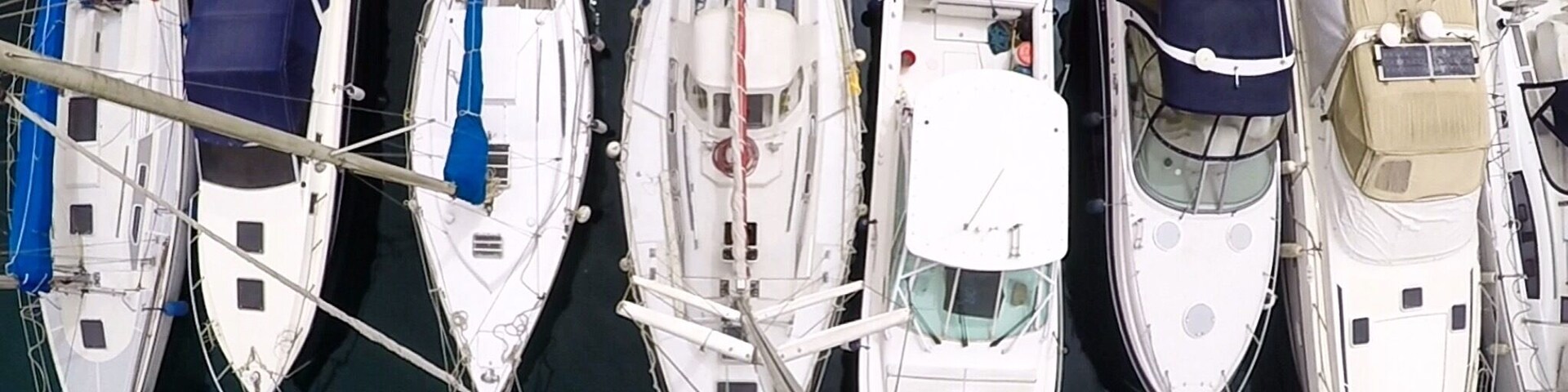 View to the boats in marina from top of the mast