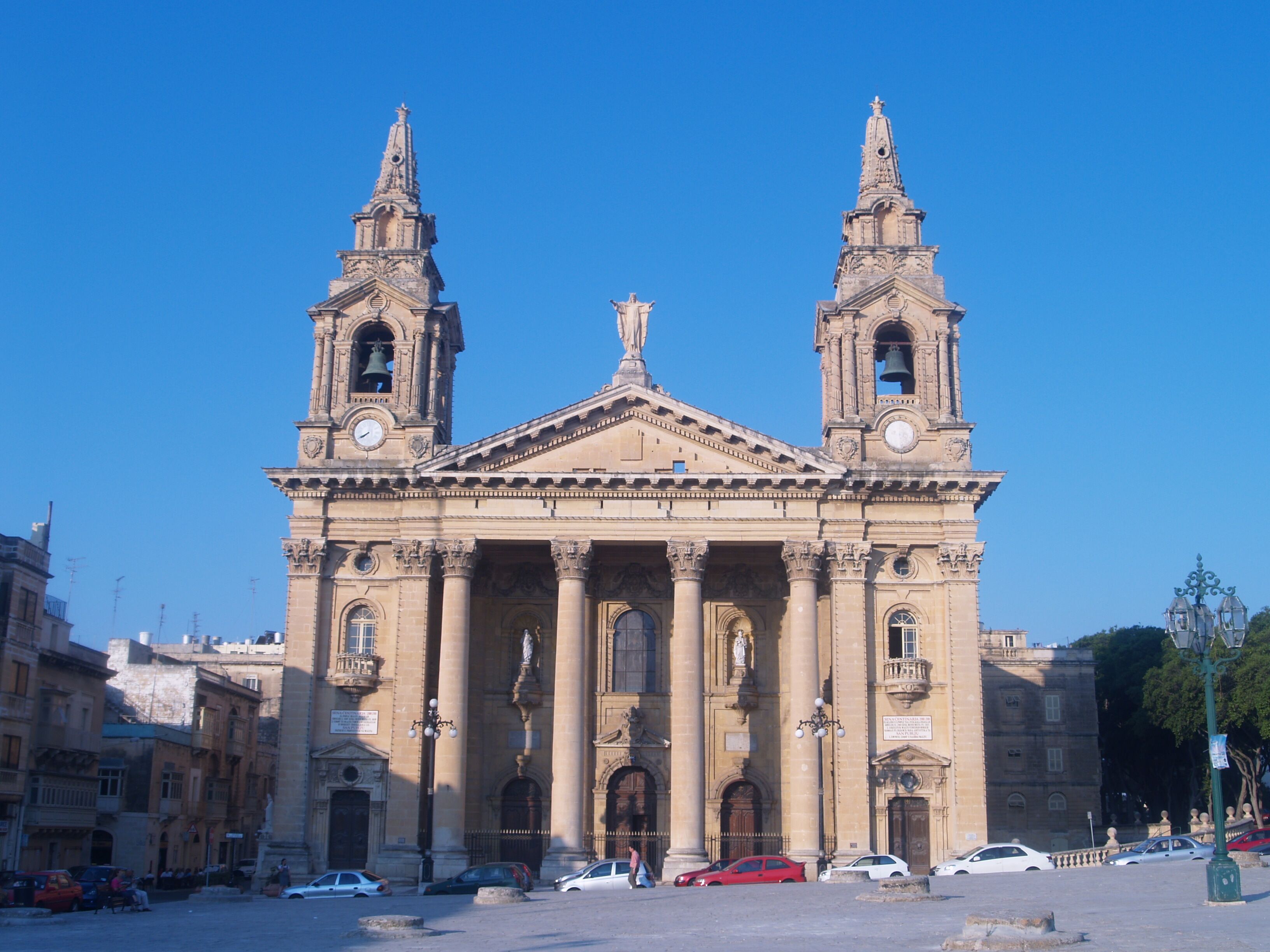 A historic church with two bell towers and a central dome.