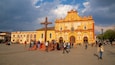 San Cristobal de las Casas Cathedral which includes a square or plaza and heritage elements as well as a small group of people