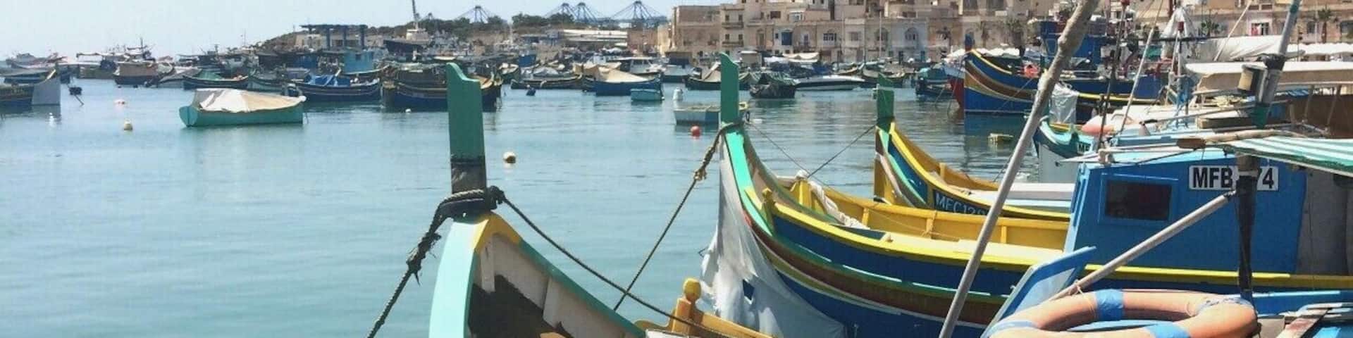 Marsaxlokk is the main fishing harbour in Malta and itâs base for 70% of the islandâs fishing fleet. It is the best place to see the Luzzus, the traditional Maltese fishing boats which all have the mythical eye of Osiris painted on their prows. It is quite a scenery to see such a colorful bay; however, the smell of fish can be quite intense sometimes.
http://www.geekyexplorer.com/malta-the-underrated-island-bliss/