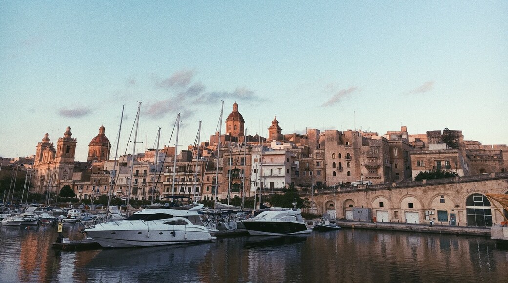 The sun setting slowly over the city is one of the most wonderful sights you can see in Malta - and one place to just sit and do that from is the ferry harbor of Cospicua - one of the famous three cities that you can visit by hopping onboard a ferry or a traditional Maltese boat.
From here, you can also visit and admire the other cities of Birgu and Senglea.
#VisitMalta