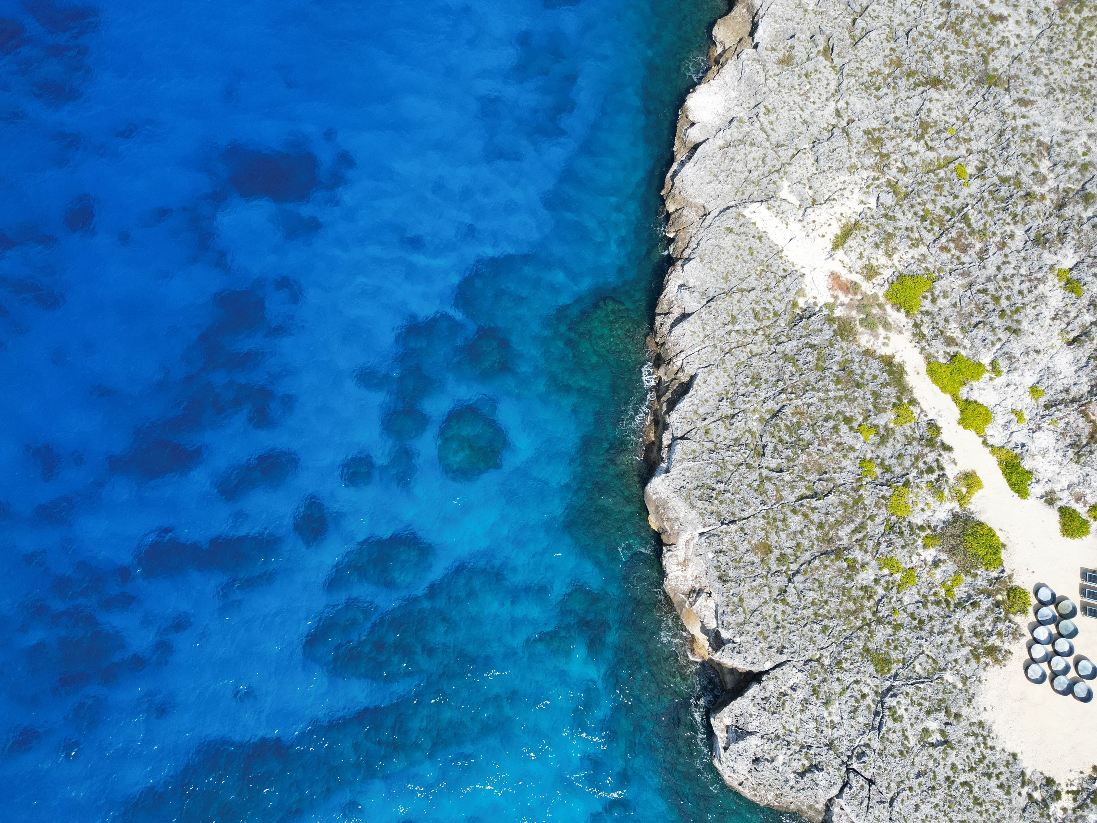 Aerial view of Bodden Town Pedro St James Savannah with iron shore community pristine blue turquoise water of the Caribbean sea ocean, Grand Cayman, Cayman Islands