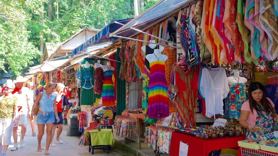 A vibrant market with colorful textiles and clothing stalls.