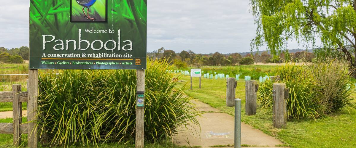 Panboola Wetlands and Heritage Project featuring signage and a garden
