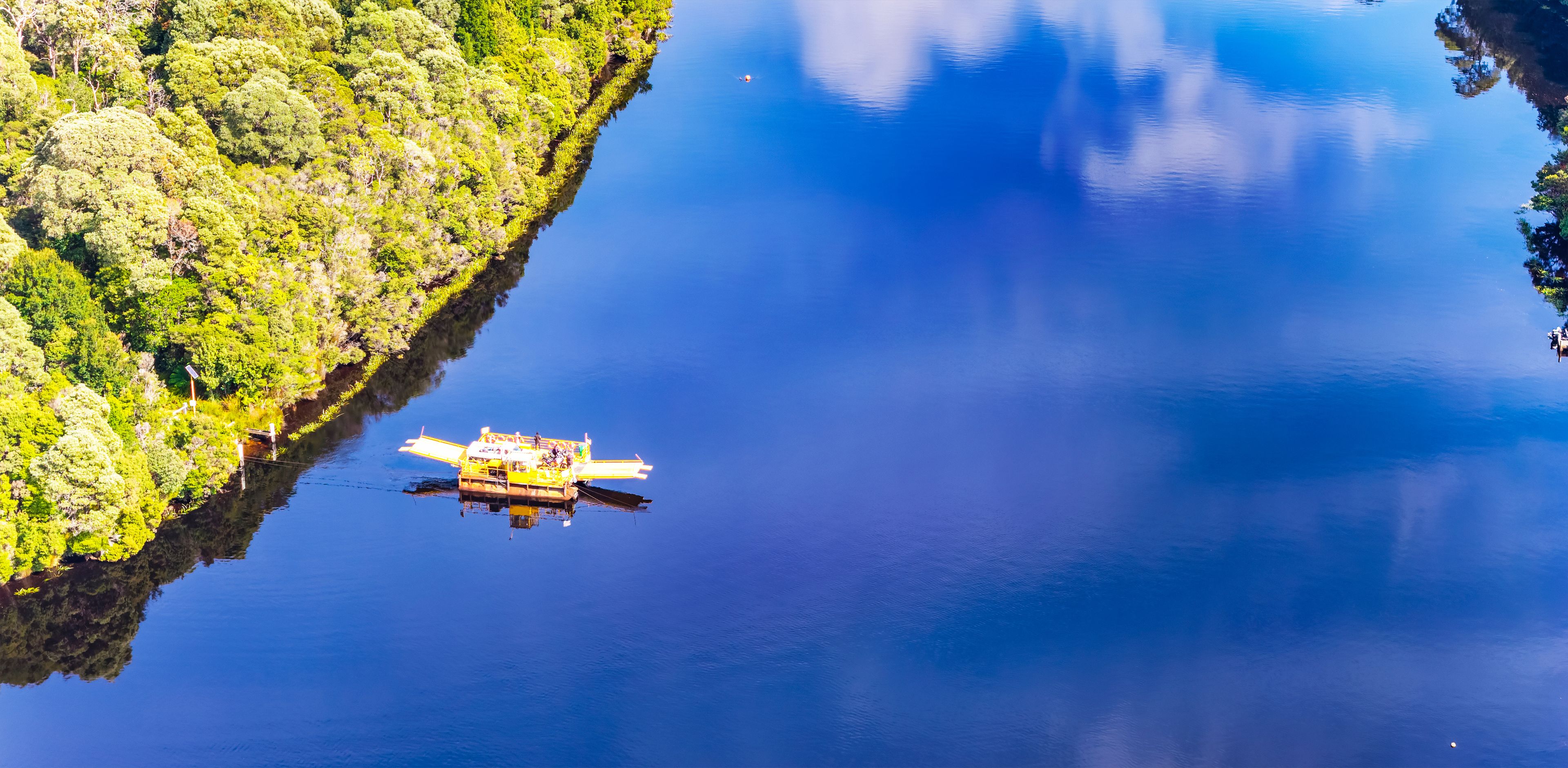 Aerial Tas Corinna Pieman barge wide no sky