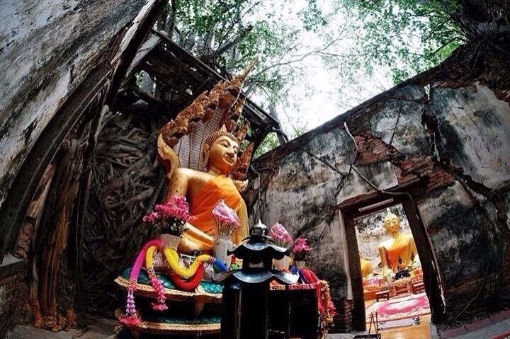 Inside Sang Kra Tai temple.There is no roof but someone put new buddha in two of the rooms here.