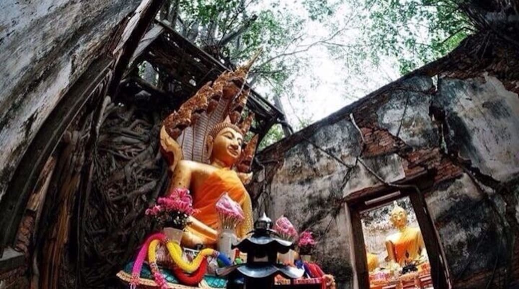 Inside Sang Kra Tai temple.There is no roof but someone put new buddha in two of the rooms here.