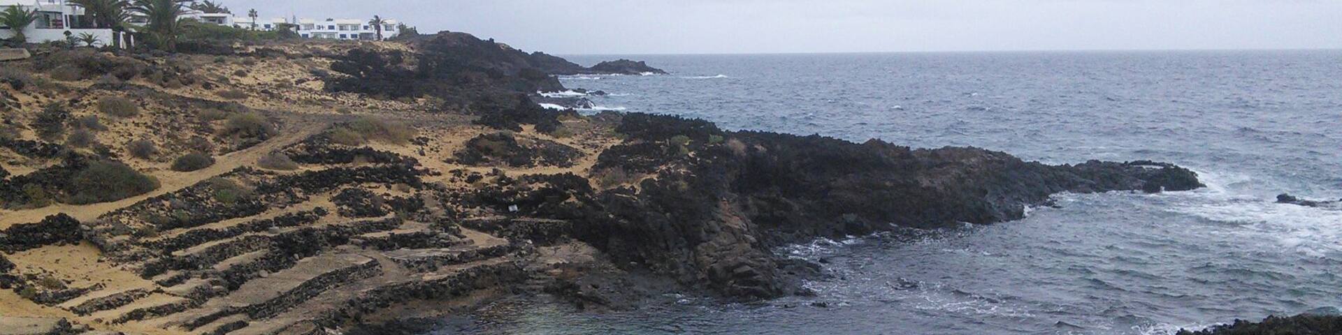 Charco del Palo, Lanzarote. Natural swimming pool, high tide.