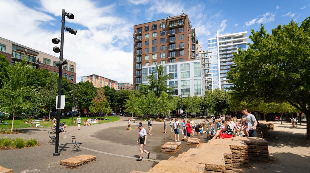 Jamison Square which includes a park as well as a small group of people