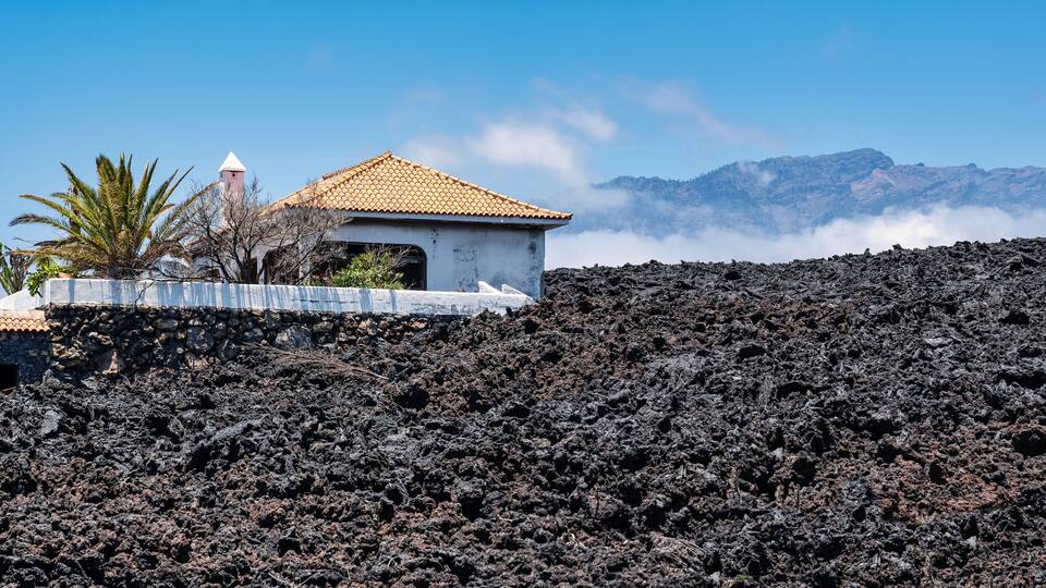Houses buried by lava in the recent eruption of the Cumbre Vieja volcano, La Palma, Canary Islands.